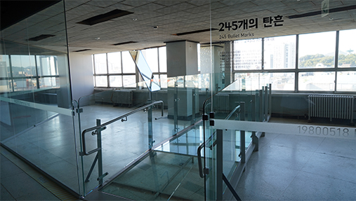 The May 18 Democratic Uprising exhibit space in the Jeonil Building, with 245 helicopter gunshot holes preserved.